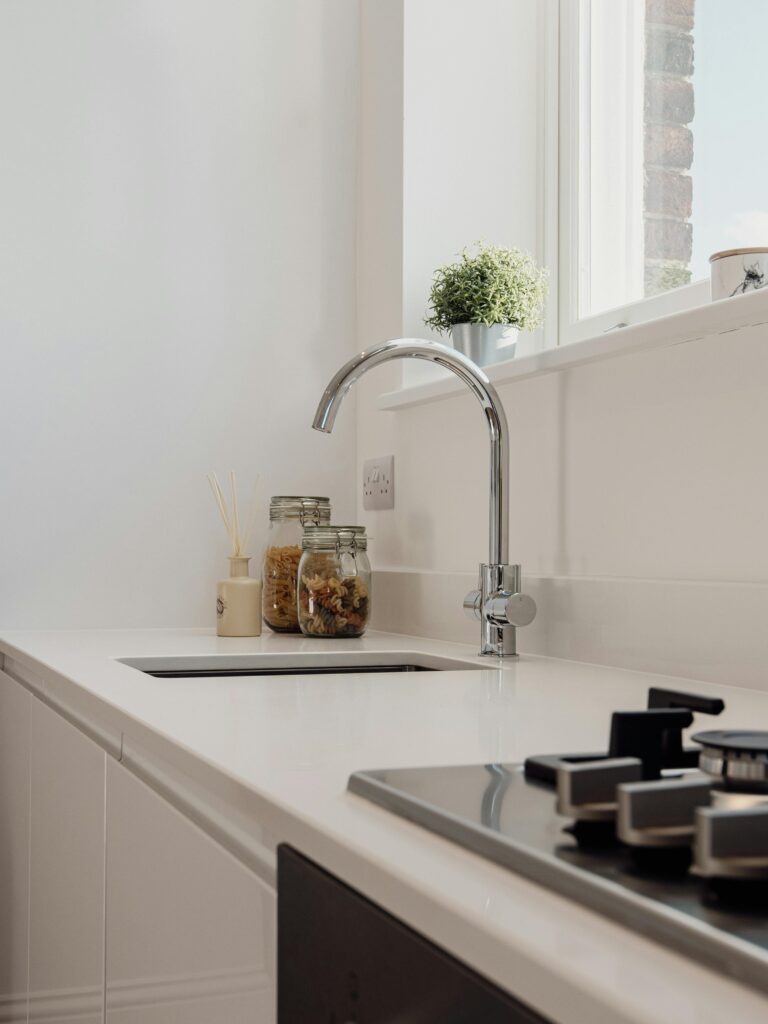 kitchen section with sink and jars